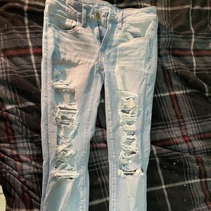 High waisted light wash ripped skinny jeans